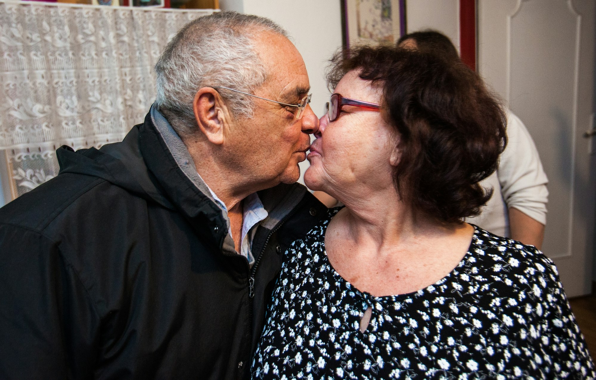 Old couple kissing